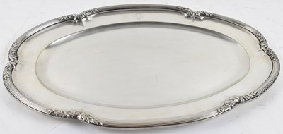 Lot 817 - A large Continental white metal shaped oval...