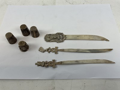 Lot 818 - A collection of white metal items comprising...