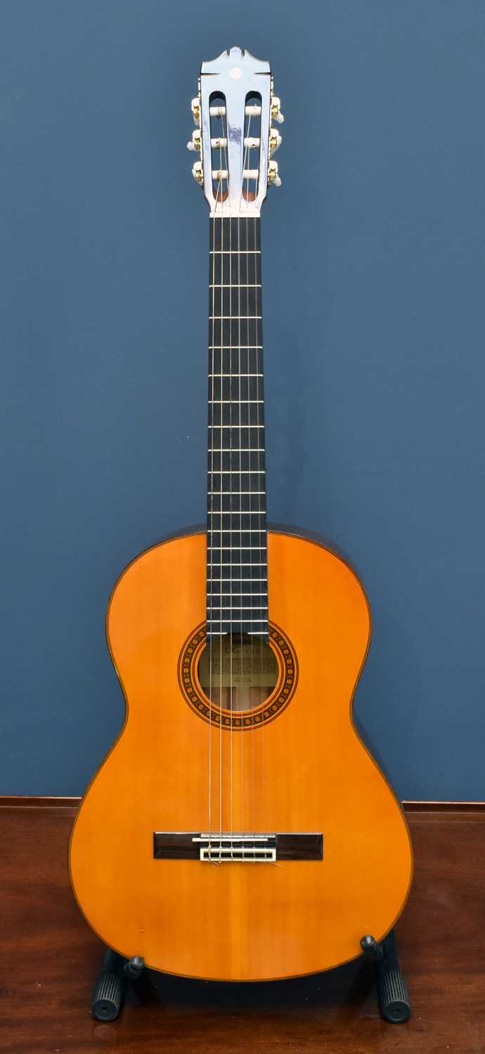 Lot 1048 - YAMAHA; a CG-130 Classic guitar, together with...