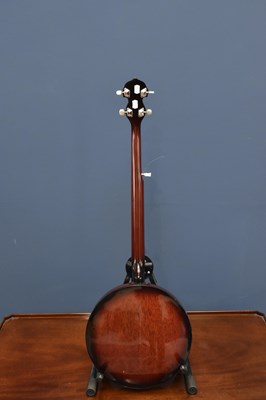 Lot 1042 - COUNTRYMAN; a five string banjo, together with...