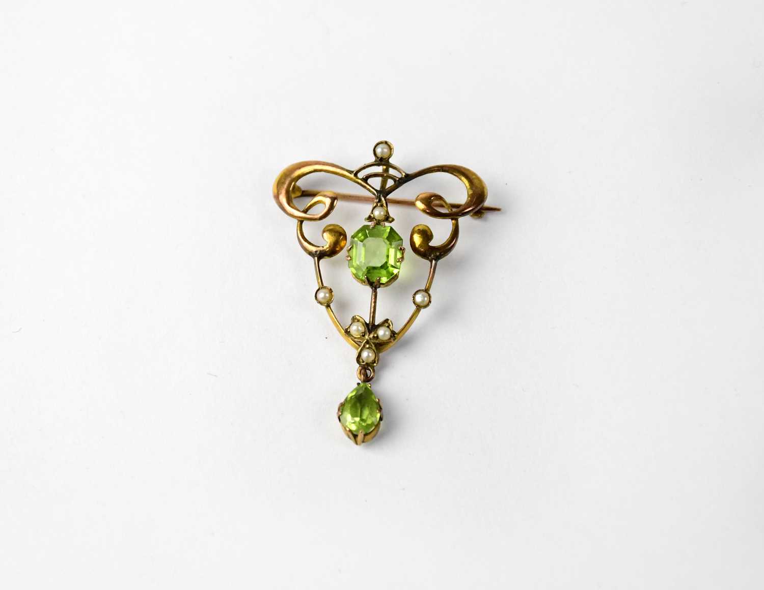 Lot 997 - An Edwardian 9ct yellow gold filigree pendant...