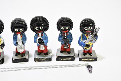 Lot 2507 - A group of seven Robertson Golly Band figures,...