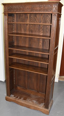 Lot 82 - A large 20th century carved oak bookcase,...