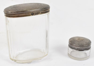 Lot 841 - Two hallmarked silver topped scent bottles....