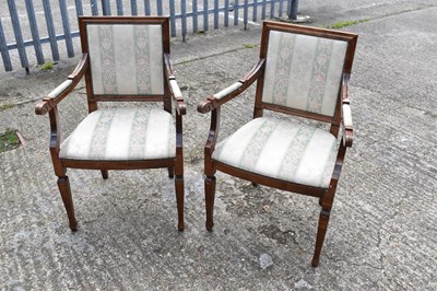 Lot 84 - A pair of reproduction open arm elbow chairs.