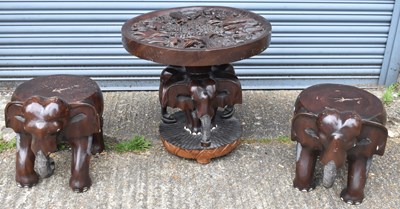 Lot 66 - A decorative carved circular elephant table...