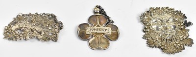 Lot 775 - Three hallmarked silver bottle labels; an...