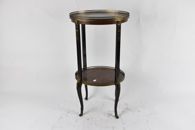 Lot 30 - A French inlaid kingwood oval two tier étagère,...