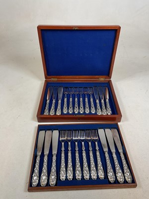 Lot 429 - A walnut cased set of silver plated fish...