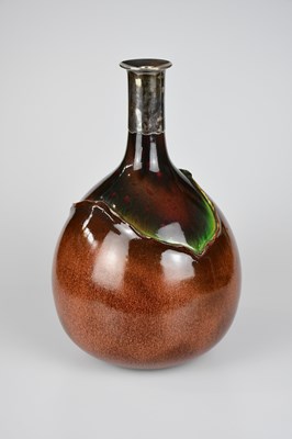 Lot 227 - BRETBY; a large bottle vase with white metal...