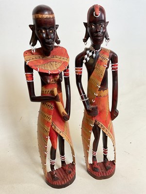 Lot 24 - A pair of tall African tribal figures.