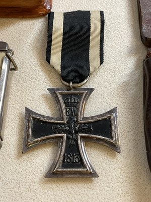 Lot 21 - A small carved box, an Iron Cross, base metal...