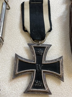 Lot 21 - A small carved box, an Iron Cross, base metal...