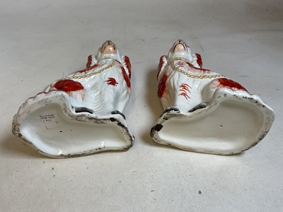 Lot 240 - A pair of 19th century Staffordshire dogs,...