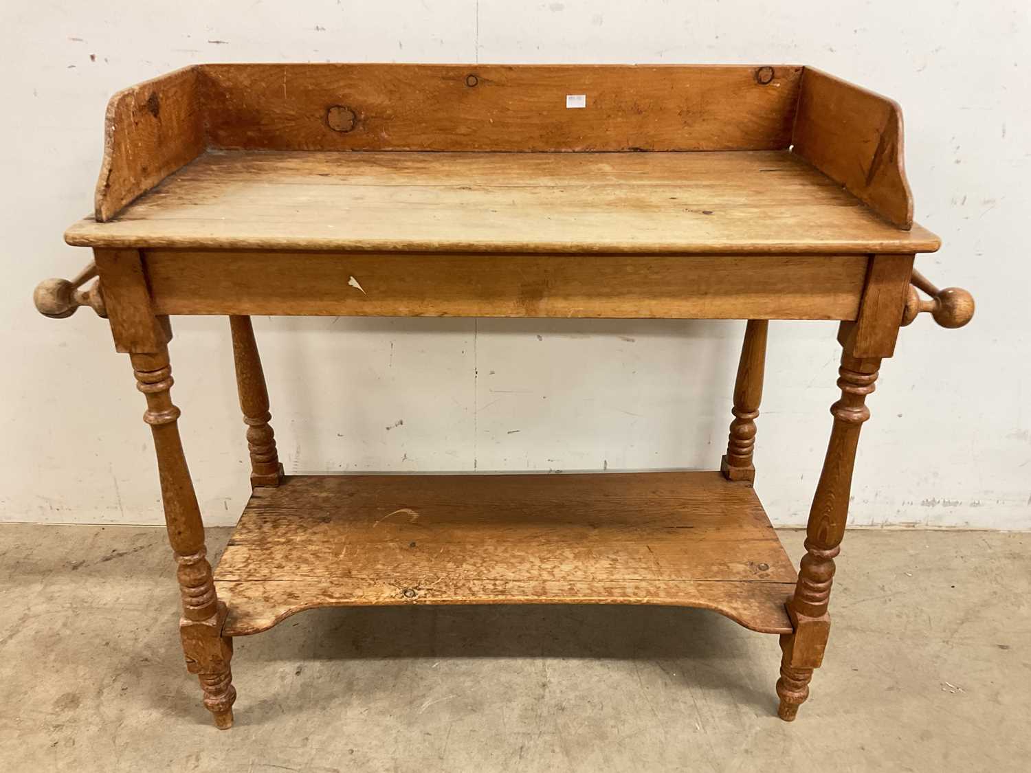 Lot 778 - An antique pine wash stand with lower shelf,...