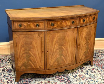 Lot 2565 - A mahogany bowfronted sideboard, with three...