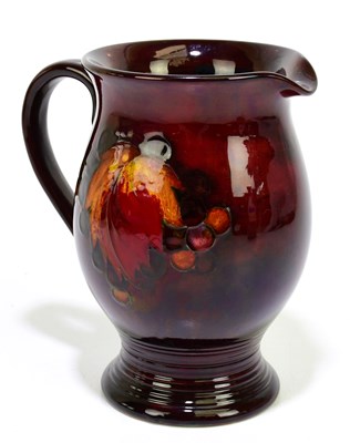 Lot 23 - WILLIAM MOORCROFT; a jug with ribbed foot rim,...