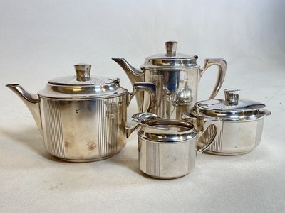 Lot 403 - CHRISTOFLE; an Art Deco four piece silver...