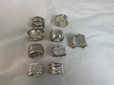 Lot 464 - Nine hallmarked silver napkin rings, various...