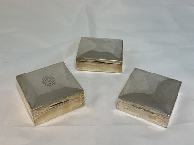 Lot 441 - Three small silver cigarette boxes, London...