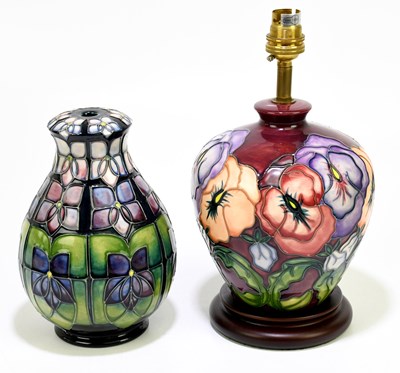 Lot 54 - MOORCROFT; a baluster shaped table lamp in the...