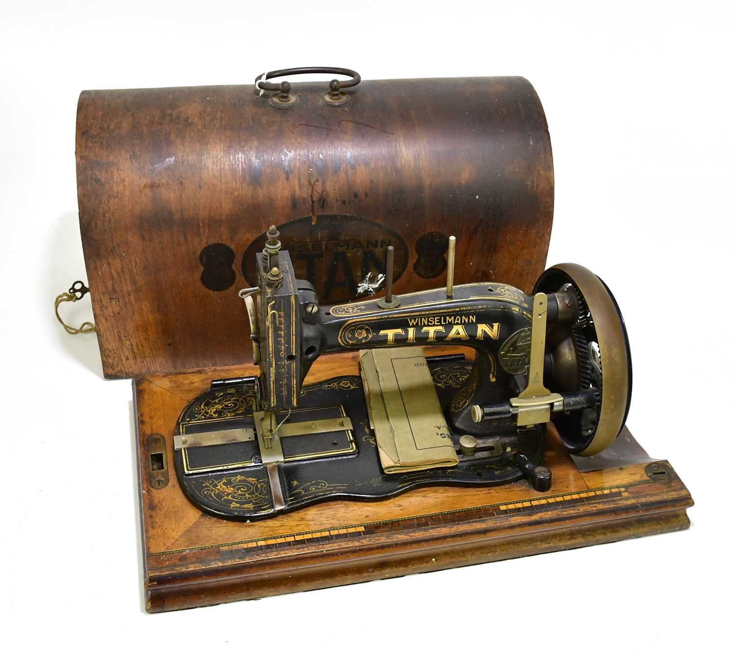 Lot 2577 WINSELMANN; a cased Titan sewing machine.