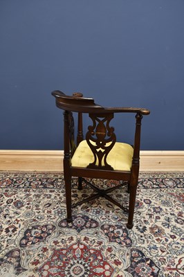 Lot 2885 - A carved oak corner chair with pierced sides...