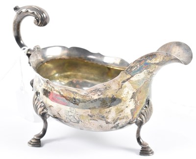 Lot 766 - A Victorian hallmarked silver sauce boat with...