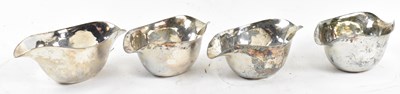 Lot 785 - A set of four white metal shaped oval...