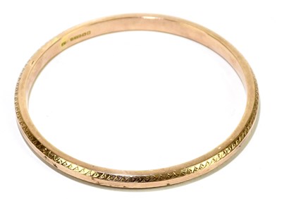 Lot 1436 - A 9ct rose gold fixed bangle, internal width...