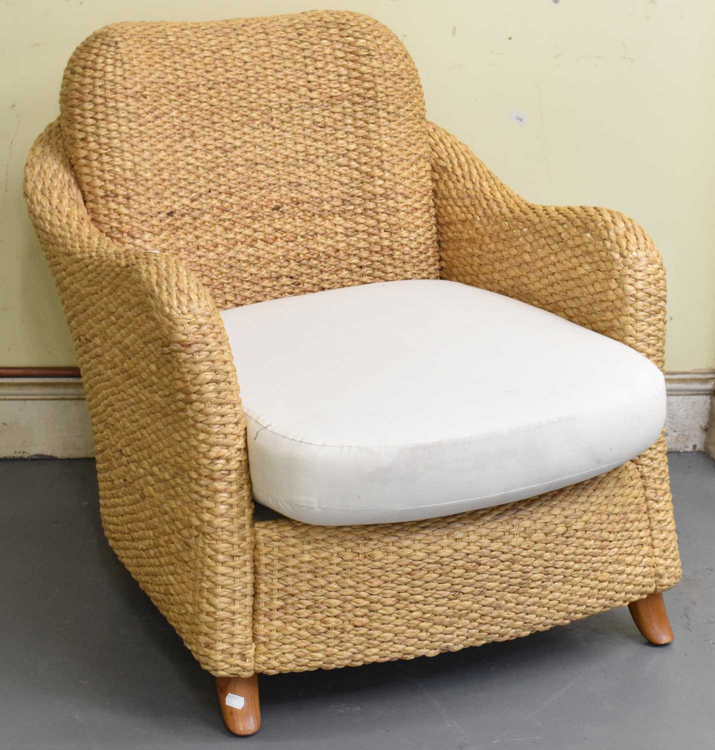 Lot 130 - A modern wicker armchair.