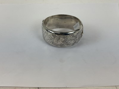 Lot 915 - A Victorian style sterling silver bangle with...