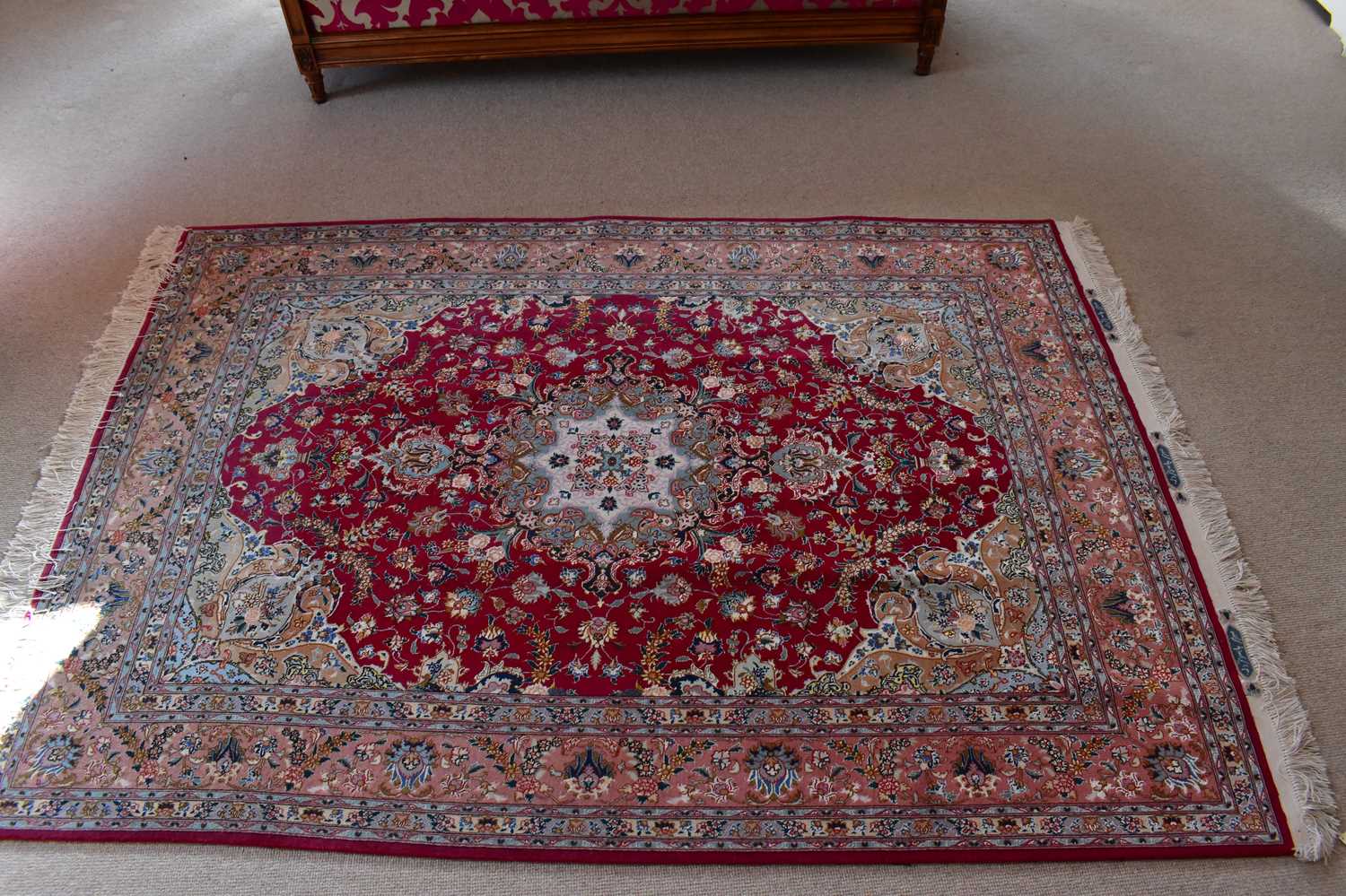 Lot 2726 - NATIONAL IRANIAN CARPETS; a red ground rug...