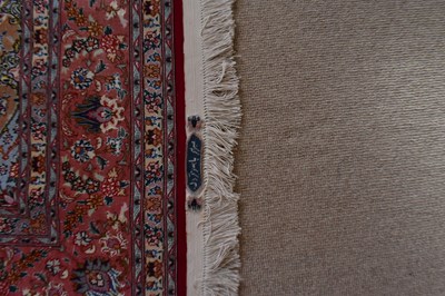 Lot 2726 - NATIONAL IRANIAN CARPETS; a red ground rug...