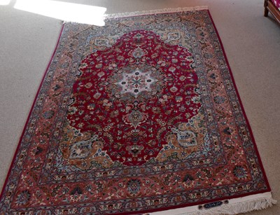 Lot 2726 - NATIONAL IRANIAN CARPETS; a red ground rug...