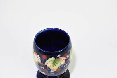 Lot 24 - MOORCROFT; a 'Leaf and Berry' pattern vase,...