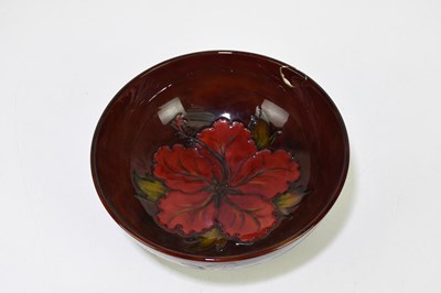 Lot 47 - MOORCROFT; a 'Hibiscus' pattern flambe bowl,...