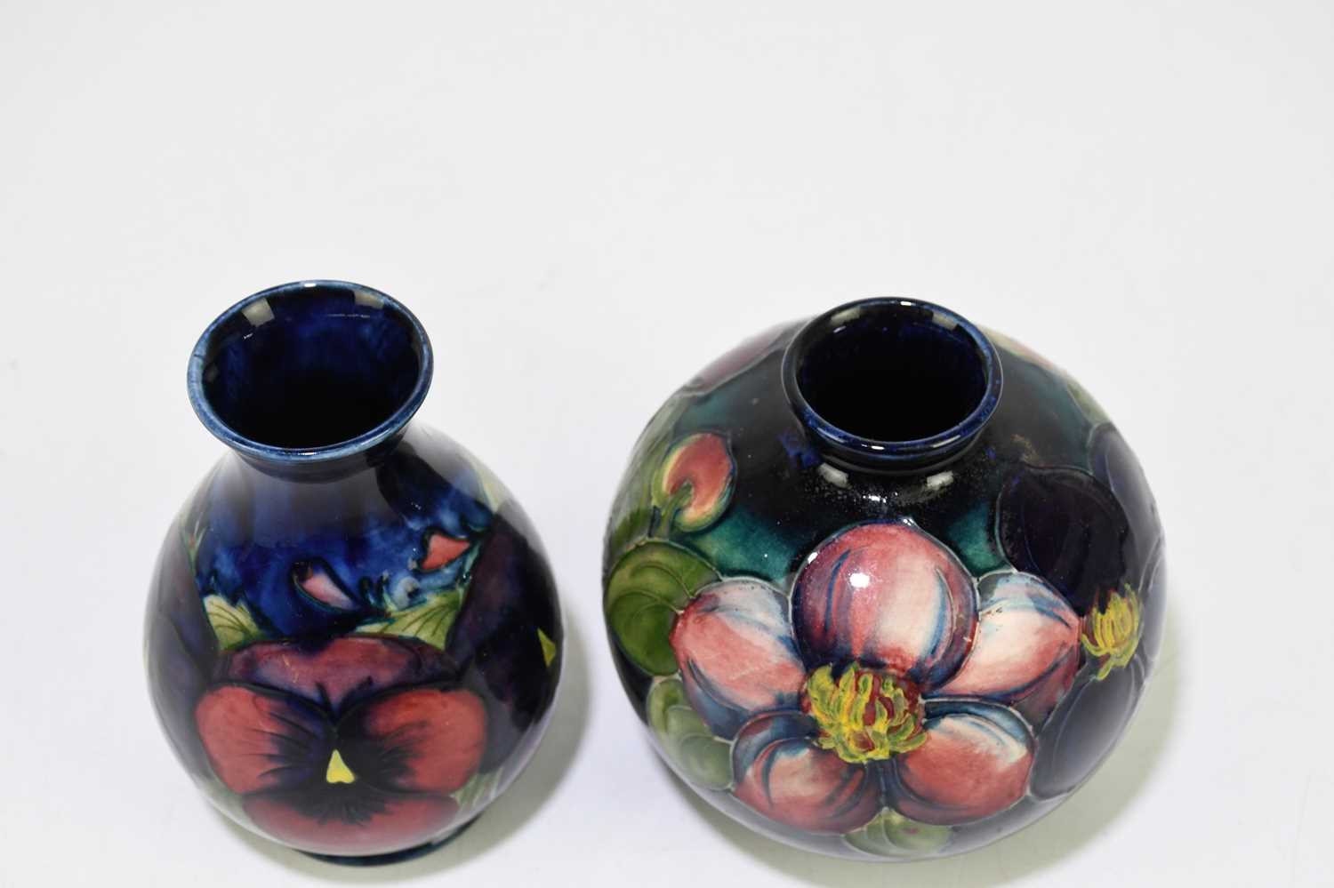 Lot 27 MOORCROFT; a 'Pansy' pattern vase, impressed