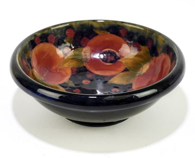 Lot 21 - MOORCROFT; a 'Pomegranate' pattern bowl, with...