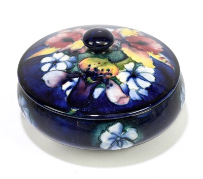 Lot 44 - MOORCROFT; a frilled 'Lily' pattern circular...