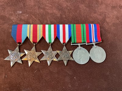 Lot 138 - A group of WWII medals on bar brooch,...