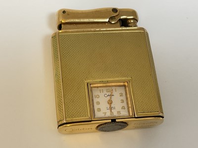 Lot 584 - COLIBRI; a 9ct gold cased 'Monopol' lighter...