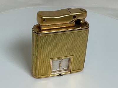 Lot 584 - COLIBRI; a 9ct gold cased 'Monopol' lighter...