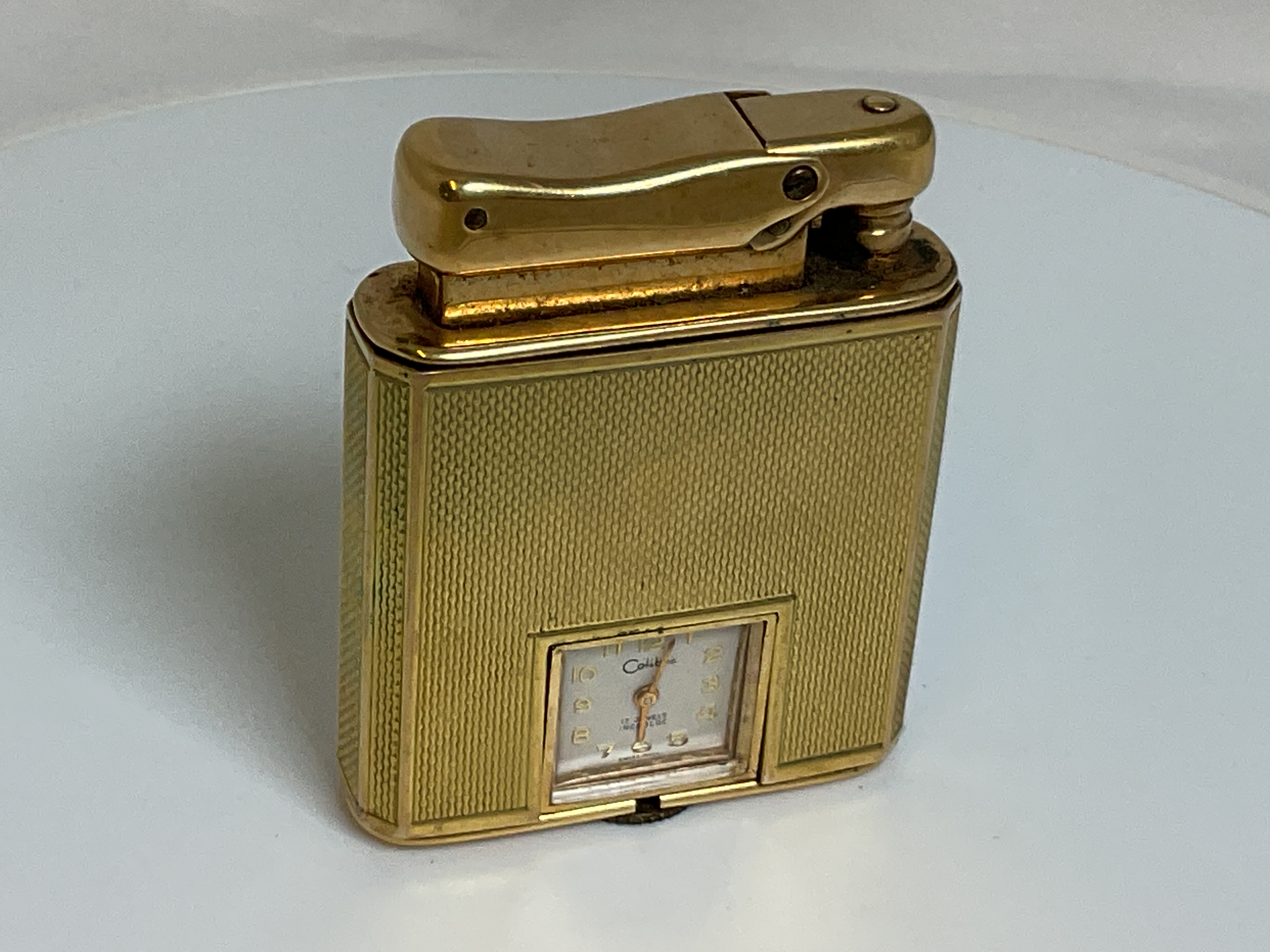 Colibri Gold Ruler Lot 584 - COLIBRI; a 9ct gold cased 'Monopol' lighter