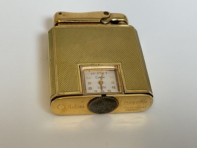 Lot 584 - COLIBRI; a 9ct gold cased 'Monopol' lighter...