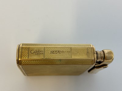 Lot 584 - COLIBRI; a 9ct gold cased 'Monopol' lighter...