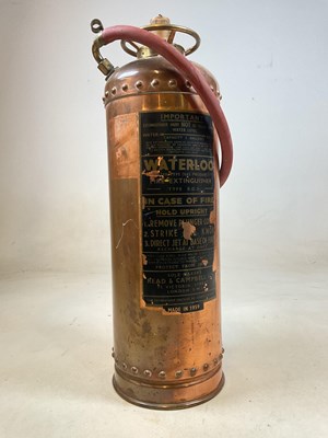 Lot 214 - A copper extinguisher made by Read & Campbell...