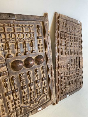 Lot 107 - Two Dogon grain doors with carved detail, Mali,...