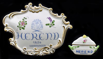 Lot 559 - HEREND; a hand painted porcelain advertising plaque