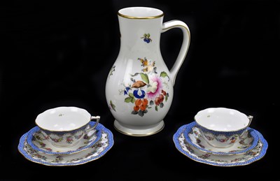 Lot 486 - HEREND; two porcelain trios with hand painted floral decoration